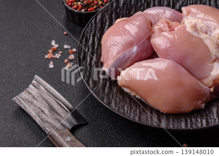 Raw chicken thigh fillet, boneless and skinless, for roasting. Raw thigh fillet Raw chicken thigh fillet, boneless and skinless, for roasting. Raw thigh fillet 139148010