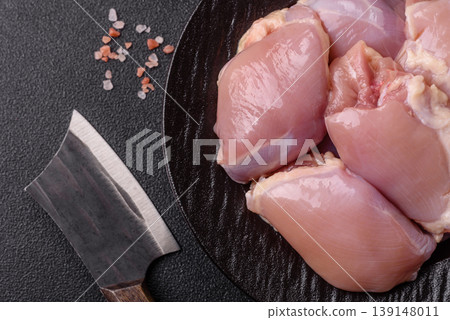 Raw chicken thigh fillet, boneless and skinless, for roasting. Raw thigh fillet Raw chicken thigh fillet, boneless and skinless, for roasting. Raw thigh fillet 139148011