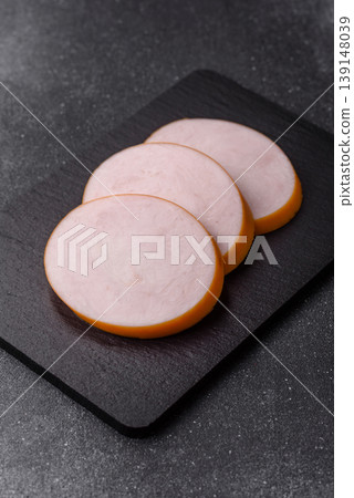 Chicken or Indian cooked sausage or ham sliced for breakfast sandwiches. Chicken sausage slices Chicken or Indian cooked sausage or ham sliced for breakfast sandwiches. Chicken sausage slices 139148039