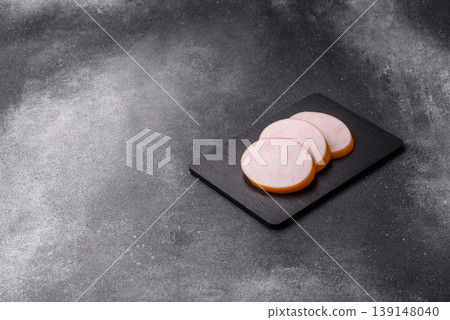 Chicken or Indian cooked sausage or ham sliced for breakfast sandwiches. Chicken sausage slices Chicken or Indian cooked sausage or ham sliced for breakfast sandwiches. Chicken sausage slices 139148040