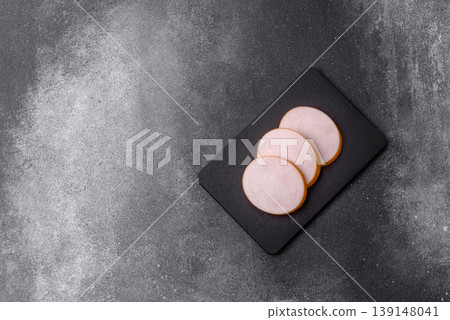Chicken or Indian cooked sausage or ham sliced for breakfast sandwiches. Chicken sausage slices Chicken or Indian cooked sausage or ham sliced for breakfast sandwiches. Chicken sausage slices 139148041