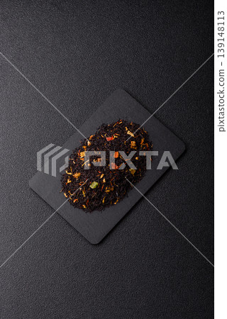 Dry black tea with herbal leaves and aromatic additives. Dry fruity black tea Dry black tea with herbal leaves and aromatic additives. Dry fruity black tea 139148113