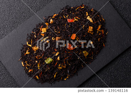 Dry black tea with herbal leaves and aromatic additives. Dry fruity black tea Dry black tea with herbal leaves and aromatic additives. Dry fruity black tea 139148116