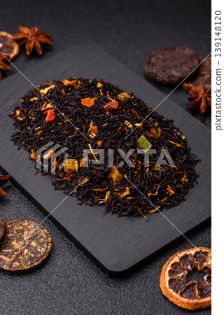 Dry black tea with herbal leaves and aromatic additives. Dry fruity black tea 139148120