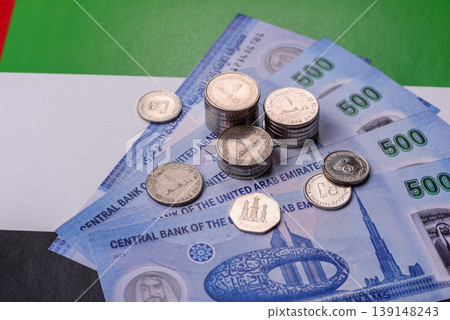 United Arab Emirates cash, dirhams and coins for exchange and financial transactions. UAE currency United Arab Emirates cash, dirhams and coins for exchange and financial transactions. UAE currency 139148243