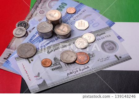 United Arab Emirates cash, dirhams and coins for exchange and financial transactions. UAE currency United Arab Emirates cash, dirhams and coins for exchange and financial transactions. UAE currency 139148246