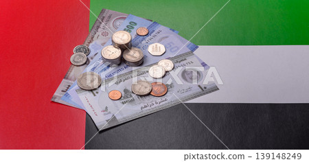 United Arab Emirates cash, dirhams and coins for exchange and financial transactions. UAE currency United Arab Emirates cash, dirhams and coins for exchange and financial transactions. UAE currency 139148249
