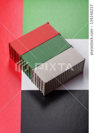 Cargo container on the uae flag as a conceptual backdrop for goods export. Cargo container Cargo container on the uae flag as a conceptual backdrop for goods export. Cargo container 139148257