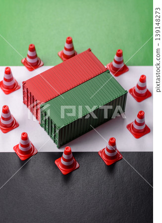 The cargo container ban on the uae flag as a conceptual backdrop. The cargo container embargo 139148273