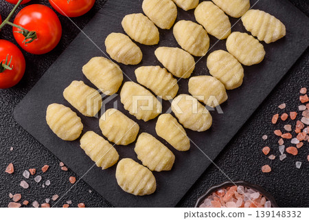 Raw homemade potato gnocchi, made with salt and spices, ready for lunch. Raw gnocchi Raw homemade potato gnocchi, made with salt and spices, ready for lunch. Raw gnocchi 139148332