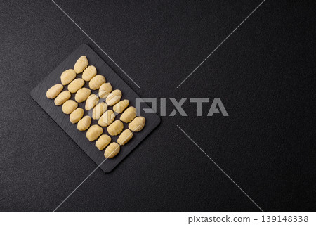 Raw homemade potato gnocchi, made with salt and spices, ready for lunch. Raw gnocchi 139148338
