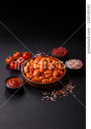 Homemade potato gnocchi with Bolognese sauce, seasoned with salt and spices. Gnocchi with sauce 139148342