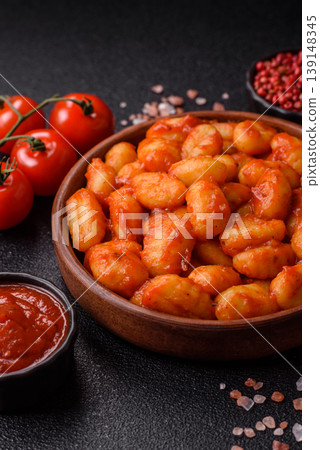Homemade potato gnocchi with Bolognese sauce, seasoned with salt and spices. Gnocchi with sauce Homemade potato gnocchi with Bolognese sauce, seasoned with salt and spices. Gnocchi with sauce 139148345