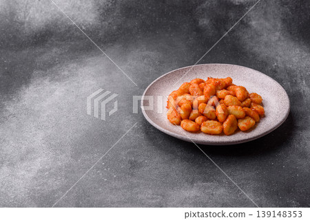 Homemade potato gnocchi with Bolognese sauce, seasoned with salt and spices. Gnocchi with sauce Homemade potato gnocchi with Bolognese sauce, seasoned with salt and spices. Gnocchi with sauce 139148353