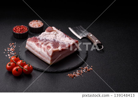 Raw fresh bacon slices with layers of meat or prosciutto prepared for frying. Raw bacon Raw fresh bacon slices with layers of meat or prosciutto prepared for frying. Raw bacon 139148413