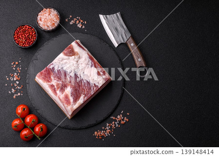 Raw fresh bacon slices with layers of meat or prosciutto prepared for frying. Raw bacon 139148414