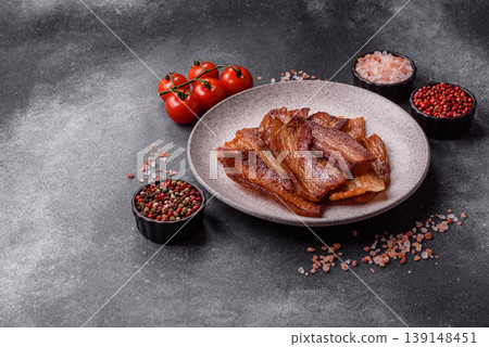 Fried fresh bacon slices with layers of meat or prosciutto prepared for breakfast. Fried bacon Fried fresh bacon slices with layers of meat or prosciutto prepared for breakfast. Fried bacon 139148451