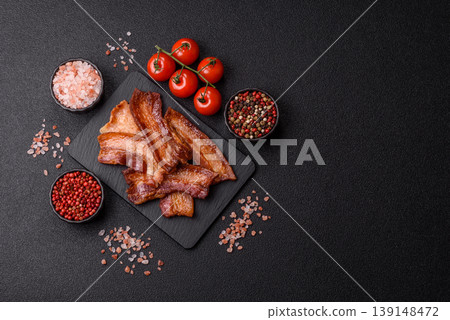 Fried fresh bacon slices with layers of meat or prosciutto prepared for breakfast. Fried bacon Fried fresh bacon slices with layers of meat or prosciutto prepared for breakfast. Fried bacon 139148472