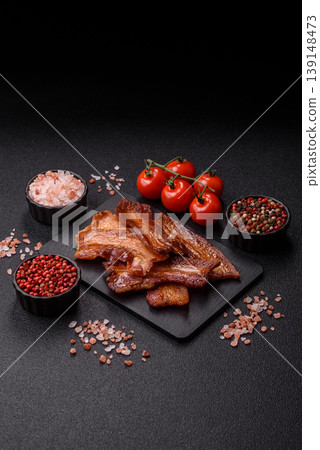Fried fresh bacon slices with layers of meat or prosciutto prepared for breakfast. Fried bacon Fried fresh bacon slices with layers of meat or prosciutto prepared for breakfast. Fried bacon 139148473