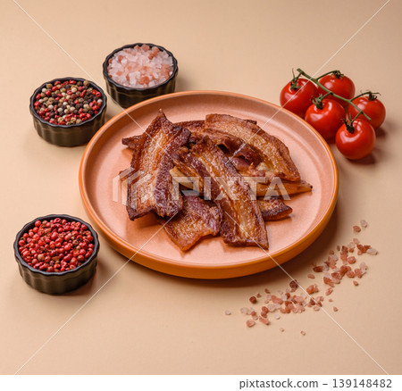 Fried fresh bacon slices with layers of meat or prosciutto prepared for breakfast. Fried bacon 139148482
