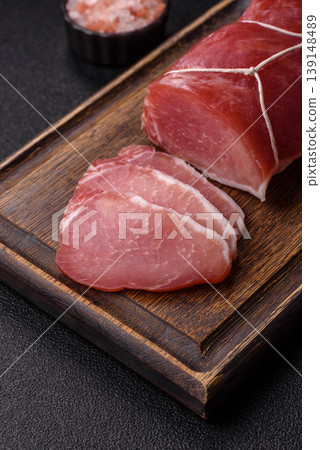 Smoked or dry cured meat slices, pork or ham with salt and spices. Smoked meat slices Smoked or dry cured meat slices, pork or ham with salt and spices. Smoked meat slices 139148489