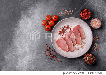 Smoked or dry cured meat slices, pork or ham with salt and spices. Smoked meat slices Smoked or dry cured meat slices, pork or ham with salt and spices. Smoked meat slices 139148509
