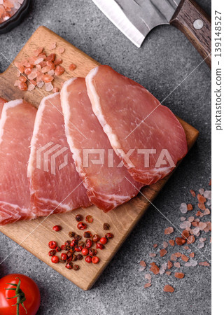 Smoked or dry cured meat slices, pork or ham with salt and spices. Smoked meat slices 139148527
