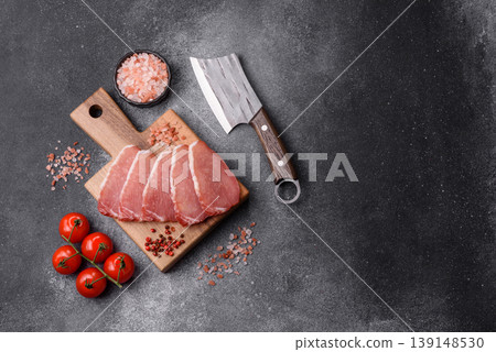 Smoked or dry cured meat slices, pork or ham with salt and spices. Smoked meat slices Smoked or dry cured meat slices, pork or ham with salt and spices. Smoked meat slices 139148530