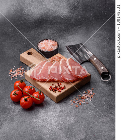 Smoked or dry cured meat slices, pork or ham with salt and spices. Smoked meat slices 139148531