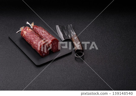 Smoked or dry cured salami slices or ham with salt and spices. Smoked sausage 139148540