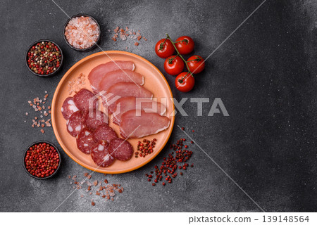 Smoked or dry cured salami slices or ham with salt and spices. Smoked sausage Smoked or dry cured salami slices or ham with salt and spices. Smoked sausage 139148564