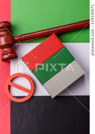 The cargo container ban on the UAE flag as a conceptual backdrop. The cargo container embargo 139148671