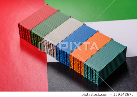 Cargo containers on the UAE flag as a conceptual backdrop for goods export. Cargo containers 139148673