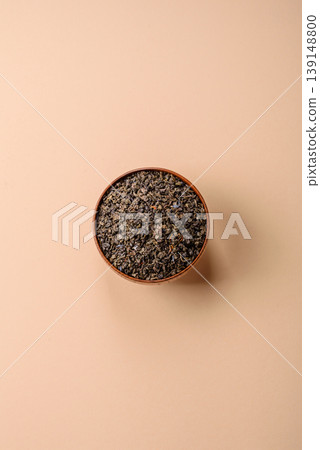 Granules of dried organic Chinese green tea with herbal additives. Dry green tea 139148800
