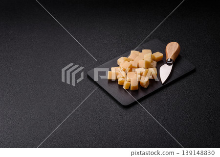 Parmesan cheese cubes for pasta, salads, and other Italian dishes. Parmesan cheese Parmesan cheese cubes for pasta, salads, and other Italian dishes. Parmesan cheese 139148830