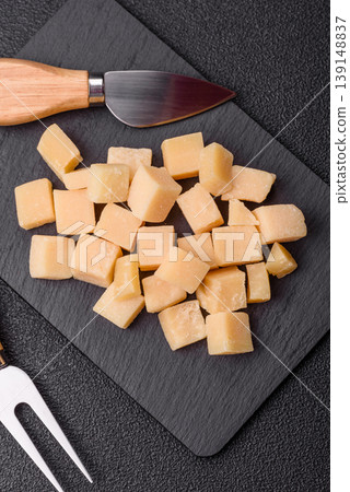 Parmesan cheese cubes for pasta, salads, and other Italian dishes. Parmesan cheese Parmesan cheese cubes for pasta, salads, and other Italian dishes. Parmesan cheese 139148837