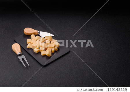 Parmesan cheese cubes for pasta, salads, and other Italian dishes. Parmesan cheese Parmesan cheese cubes for pasta, salads, and other Italian dishes. Parmesan cheese 139148839