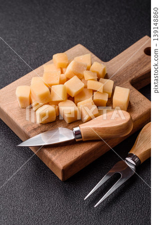 Parmesan cheese cubes for pasta, salads, and other Italian dishes. Parmesan cheese 139148860