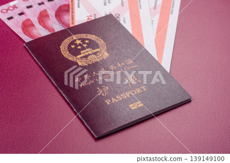 China, Chinese passport with money and flight tickets. Chinese passport China, Chinese passport with money and flight tickets. Chinese passport 139149100