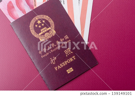 China, Chinese passport with money and flight tickets. Chinese passport China, Chinese passport with money and flight tickets. Chinese passport 139149101