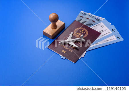 China, Chinese passport with money and flight tickets. Chinese passport China, Chinese passport with money and flight tickets. Chinese passport 139149103