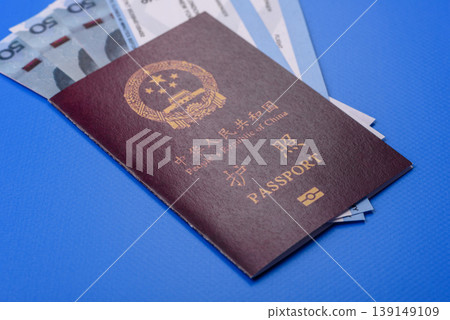 China, Chinese passport with money and flight tickets. Chinese passport China, Chinese passport with money and flight tickets. Chinese passport 139149109