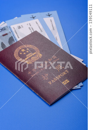 China, Chinese passport with money and flight tickets. Chinese passport China, Chinese passport with money and flight tickets. Chinese passport 139149111