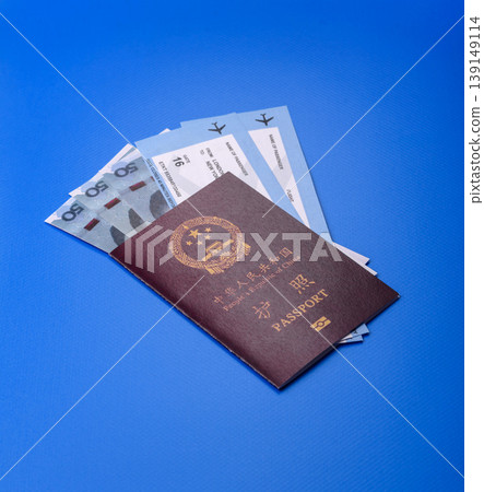 China, Chinese passport with money and flight tickets. Chinese passport China, Chinese passport with money and flight tickets. Chinese passport 139149114