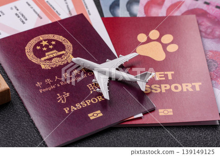 China, Chinese passport with money and flight tickets. Chinese passport China, Chinese passport with money and flight tickets. Chinese passport 139149125