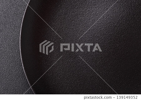An empty ceramic round plate, kitchen utensils for a dinner table. An empty plate An empty ceramic round plate, kitchen utensils for a dinner table. An empty plate 139149352