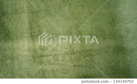 Suede texture of green color as a background macro photo. Suede texture of green color as a background macro photo. 139149702