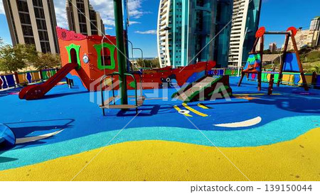 A vibrant city park playground with colorful structures and joy A vibrant city park playground with colorful structures and joy 139150044
