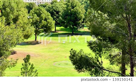 The stunning golf course is breathtaking, surrounded by lush greenery that enhances the scenery The stunning golf course is breathtaking, surrounded by lush greenery that enhances the scenery 139150141