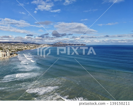 Serene coastal scene with waves, Peaceful beach landscape with rhythmic waves and expansive horizon 139150211